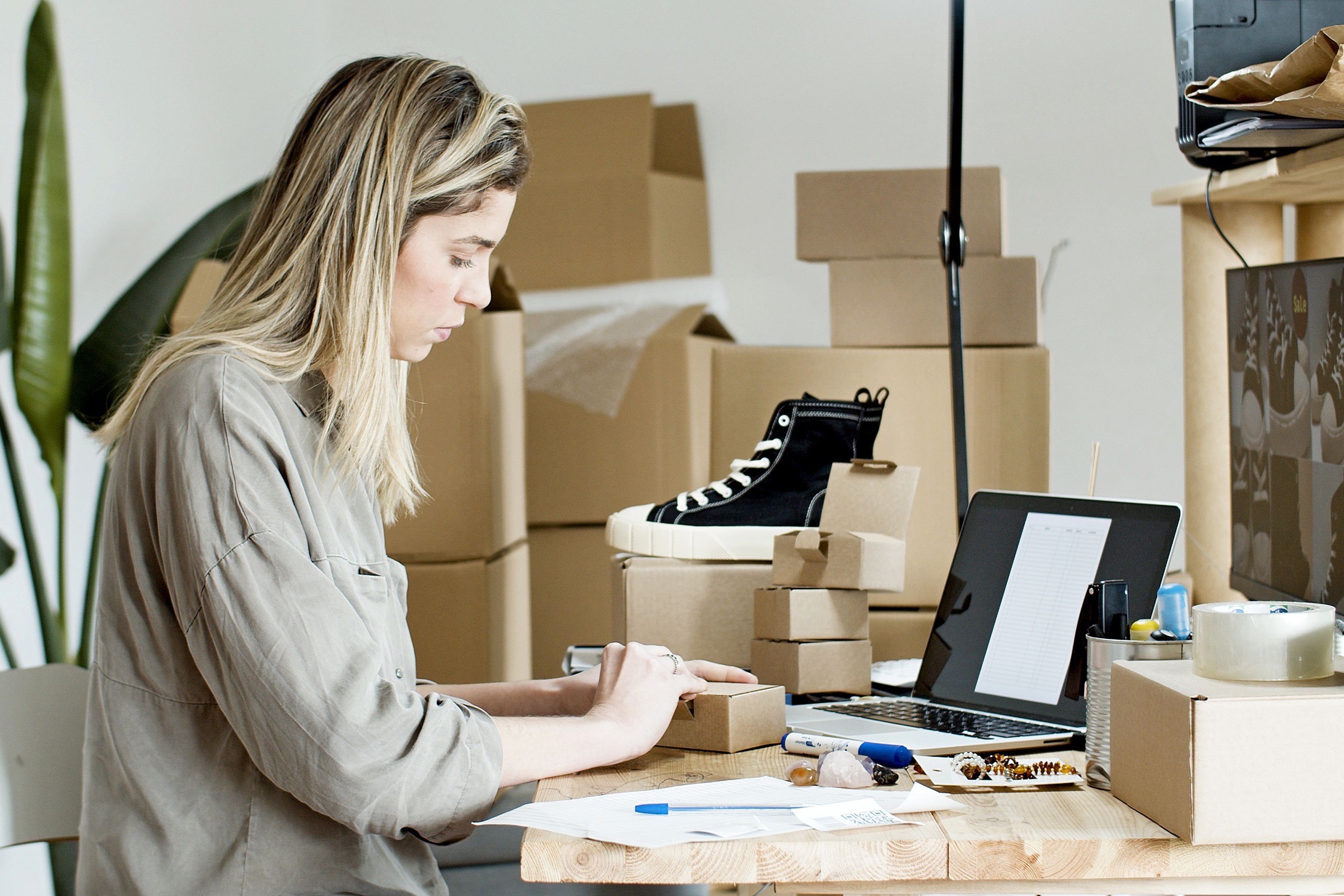 A business owner preparing unbranded products for online retail