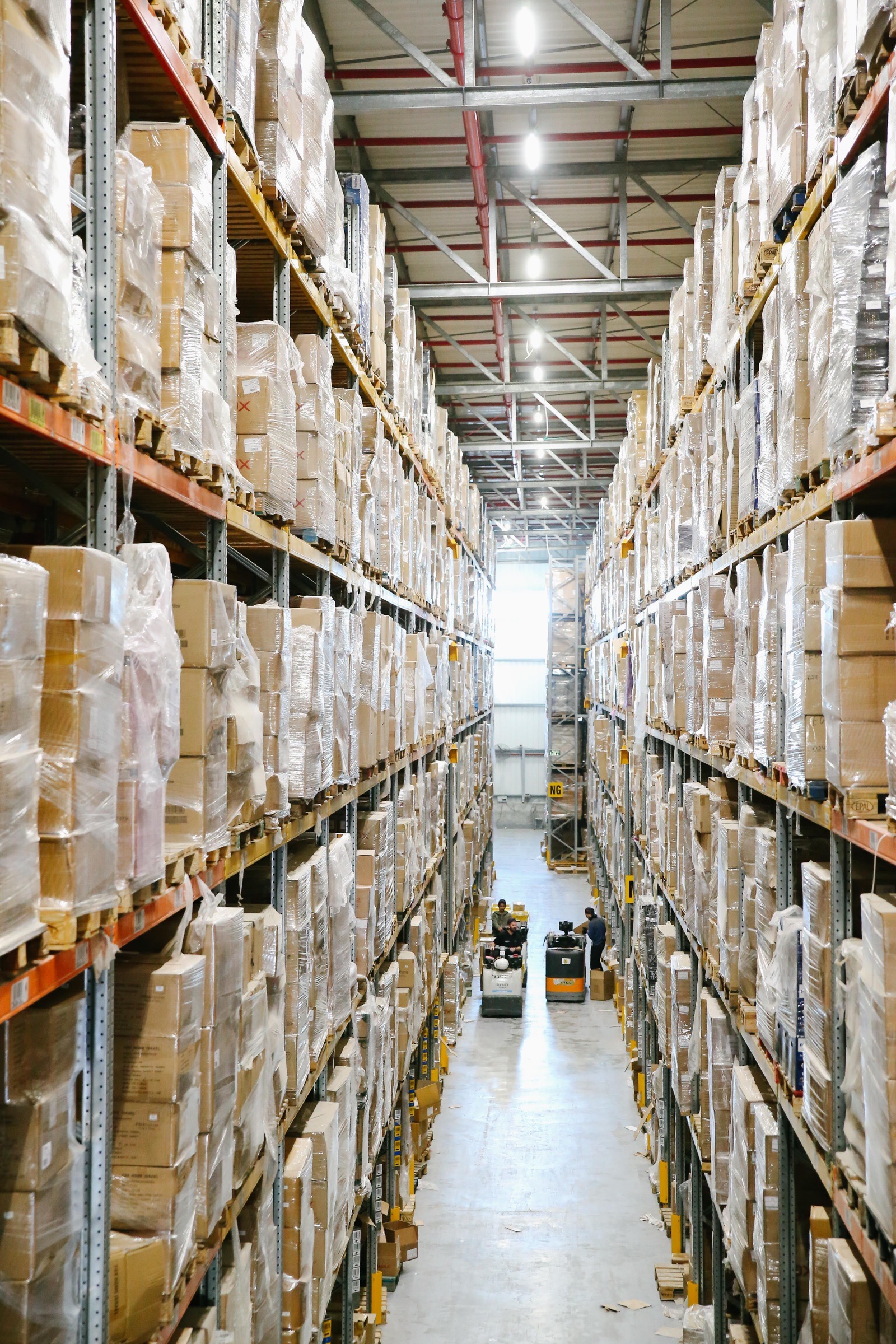 A warehouse aisle filled with palletised trade stock